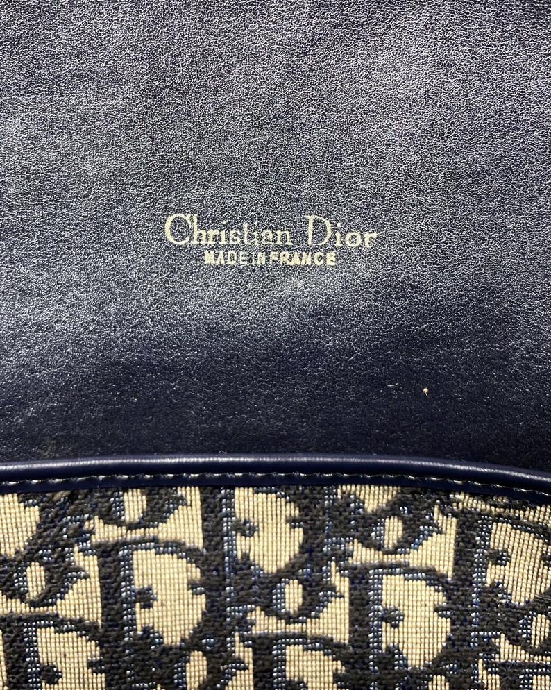 FRUIT Vintage 1970s Christian Dior navy monogram trotter oblique bowling bag. It features a large CD logo to the front, leather trim, 2 internal logo pockets and logo zipper pull.