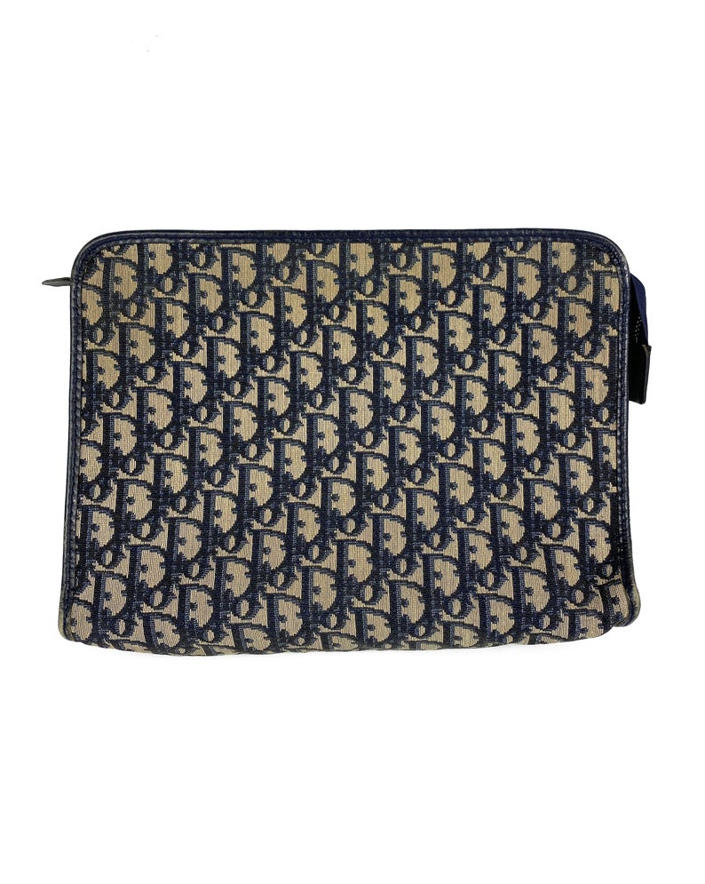 FRUIT Vintage Christian Dior 1980s navy trotter oblique monogram clutch bag. Features a classic pochette style shape with top zipper, internal pockets and vinyl lining.