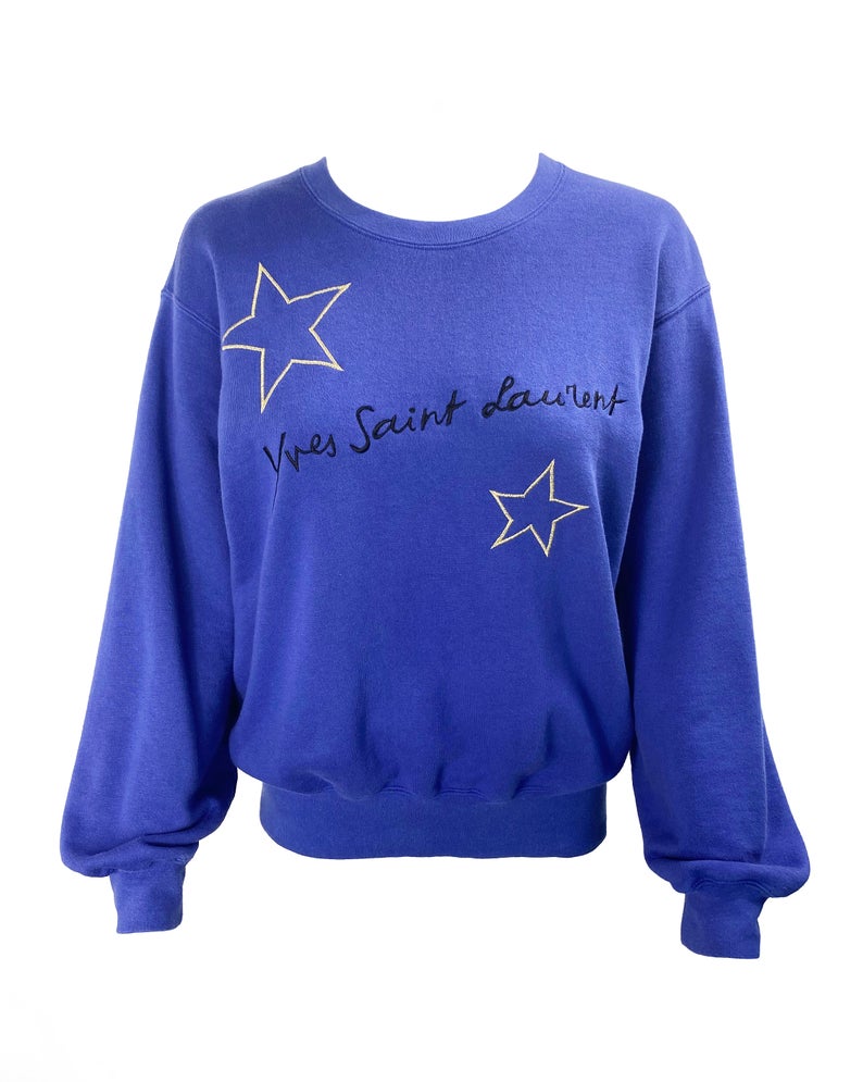 FRUIT Vintage Yves Saint Laurent logo star embroidered blue sweatshirt. Features a large text YSL logo at front and a classic 90's cut.