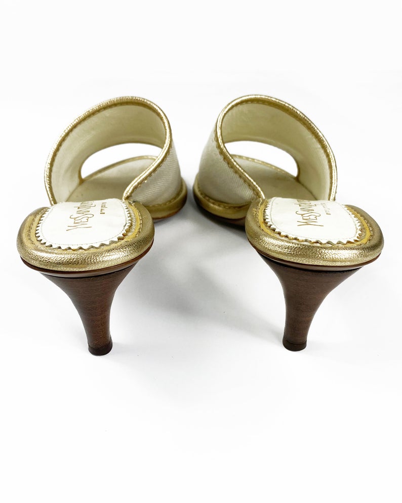 FRUIT Vintage Yves Saint Laurent logo canvas mules with gold leather trim. Features a a large gold leather YSL logo at front and stacked wooden heels.