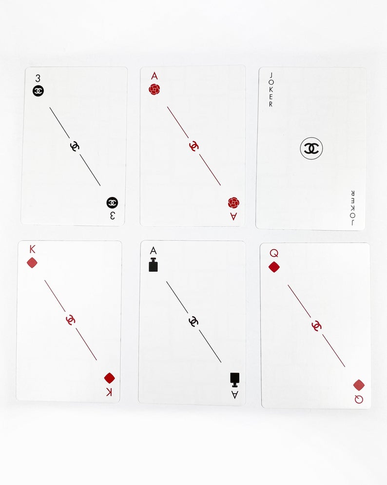 FRUIT Vintage Chanel logo printed playing card deck VIP gift set. Each of the different card numbers features a different iconic Chanel symbol (such as perfume bottles, camellias and the classic logos).