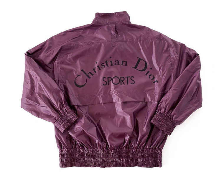 FRUIT Vintage rare Purple Christian Dior Sport Logo bomber jacket from the 1980s. It features a classic 1980s bomber jacket cut with over flap and large Christian Dior Sport text logo printed at rear.