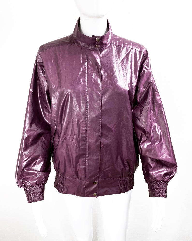 FRUIT Vintage rare Purple Christian Dior Sport Logo bomber jacket from the 1980s. It features a classic 1980s bomber jacket cut with over flap and large Christian Dior Sport text logo printed at rear.